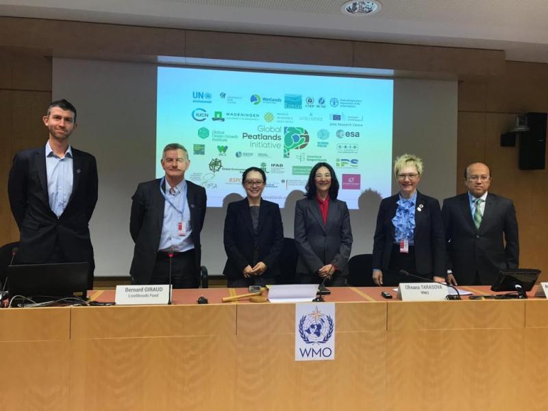 Stuart Crane of UN Environment (left) gives a presentation highlighting the importance of peatlands wetlands as a natural solution for reducing carbon emissions at the World Meteorological Organization World Wetlands Day panel discussion.